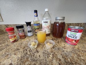 traditional method of grilling whole chickens to make huli huli chicken