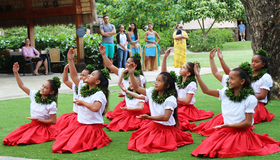 Keiki or children dancers from the Laie-based Hālau Hula o Kekela, led by kumu hula Kela Miller, perform a sitting hula on January 17, 2015, in the PCC’s Hawaiian Village. (PCC photos by Mike Foley)