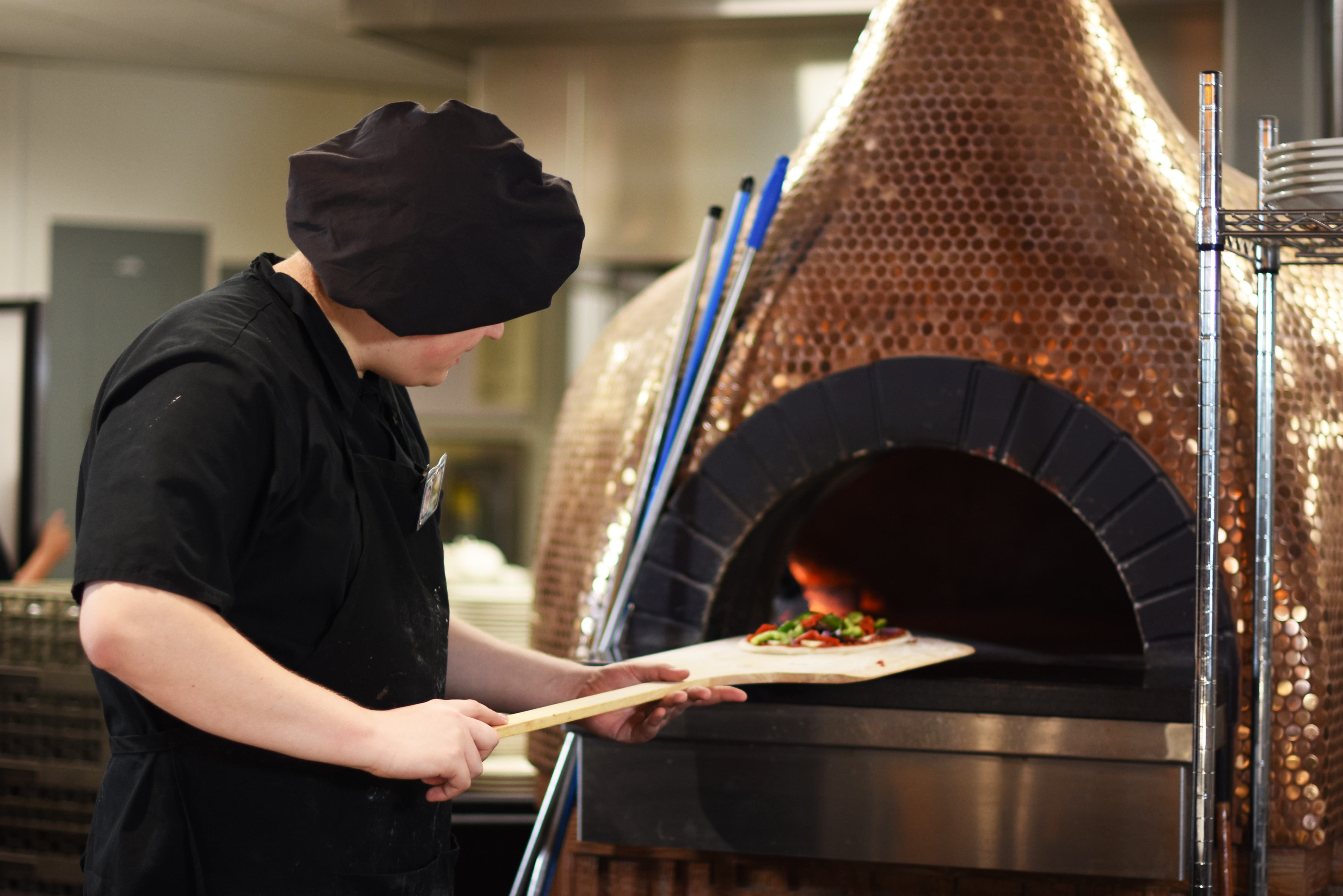 pizza making at Pounders Restaurant at the Hukilau Marketplace