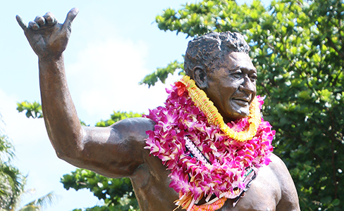 The Hamana Kalili statue welcomes people to the Polynesian Cultural Center with his worldwide-famous gesture, the shaka.