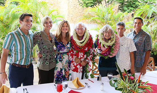 photo of David and Carolyn Hannemann and family members celebrate his retirement from the Polynesian Cultural Center