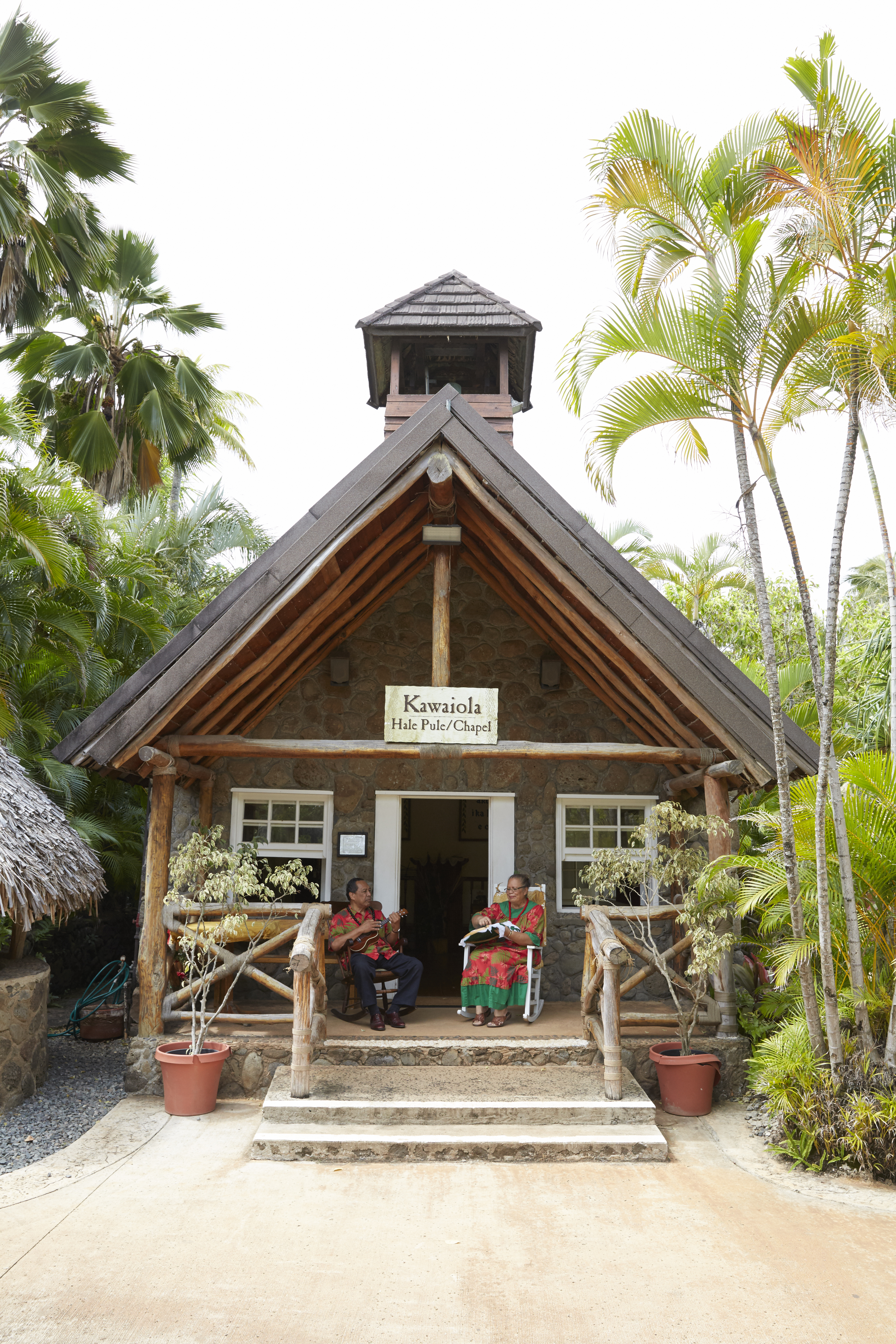 photo of the Mission Home at the Polynesian Cultural Center with the Funiomoanas on the porch