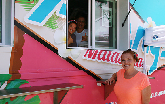 Pictured are Aubrey Warner (right) and her friendly staff from Penny's Malasadas newest food truck at the Polynesian Cultural Center's Hukilau Marketplace in Laie, Hawaii.
