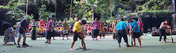 Audience members participate in We Are Samoa coconut husking