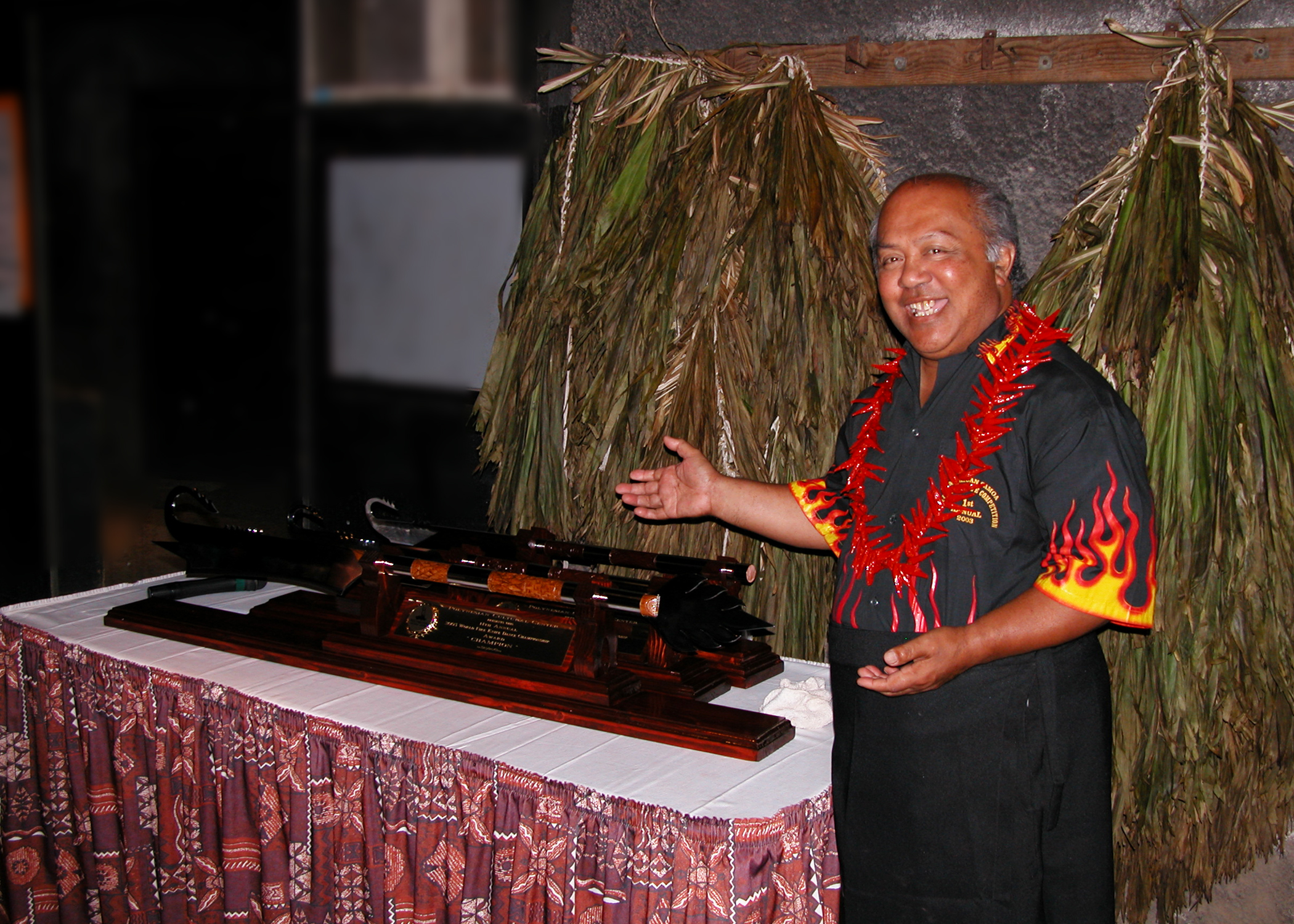 Pulefano Galea’i in 2003 displaying the handmade fireknife trophies made for that year’s competition