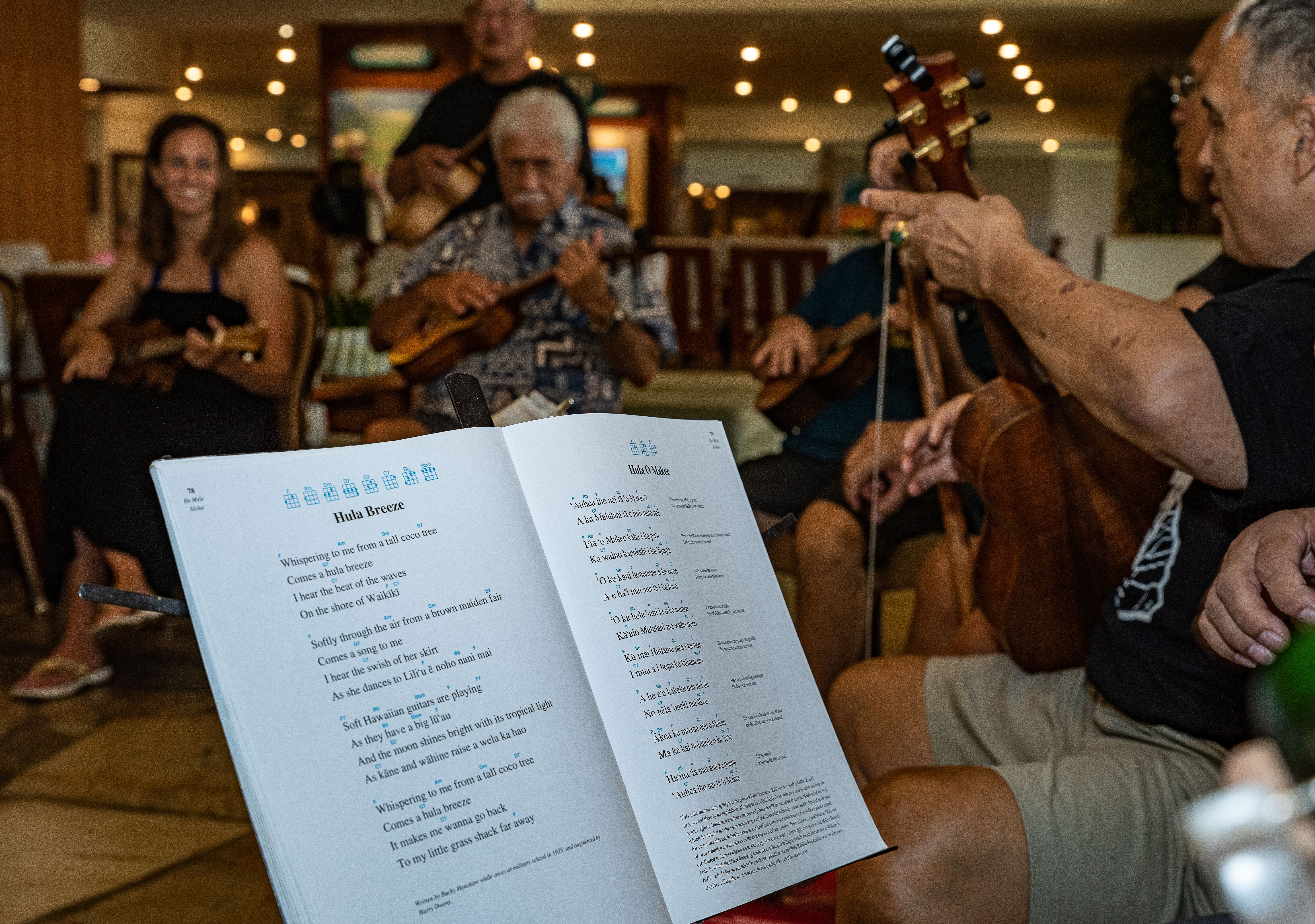 Photo of ukulele players gathered for a kanikapila at Turthle Bay during the 2019 Moanikeala Hula Festival