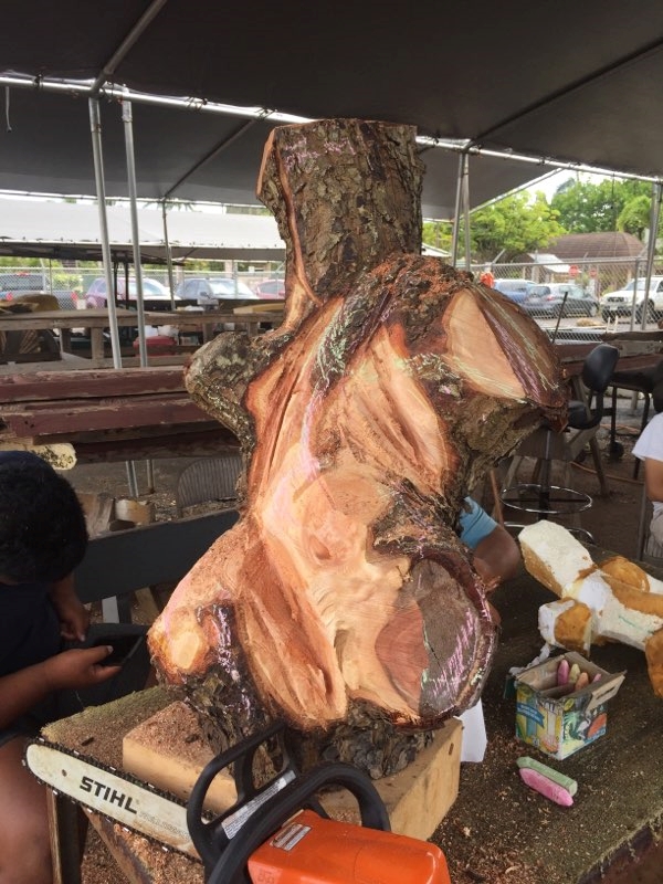 photo of a piece of ohikamania wood being carved into kane and the three baskets