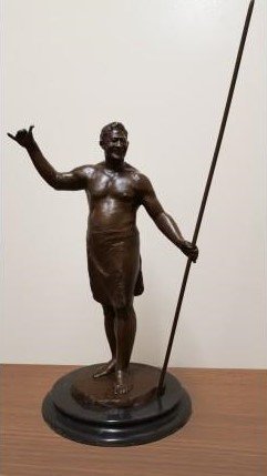 Replica of the large 7' 2" full-sized statues of Hamana Kalili, father of the shaka. This smaller statue is for sale at the Polynesian Cultural Center.