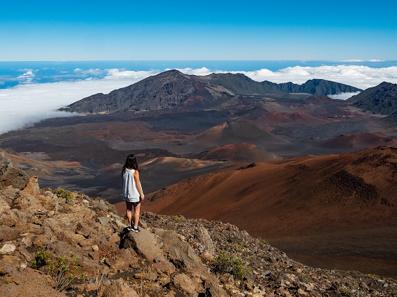 Woman tourist enjoying view of Hawaii Island, the big island, is the largest of the many islands of the state of Hawaii