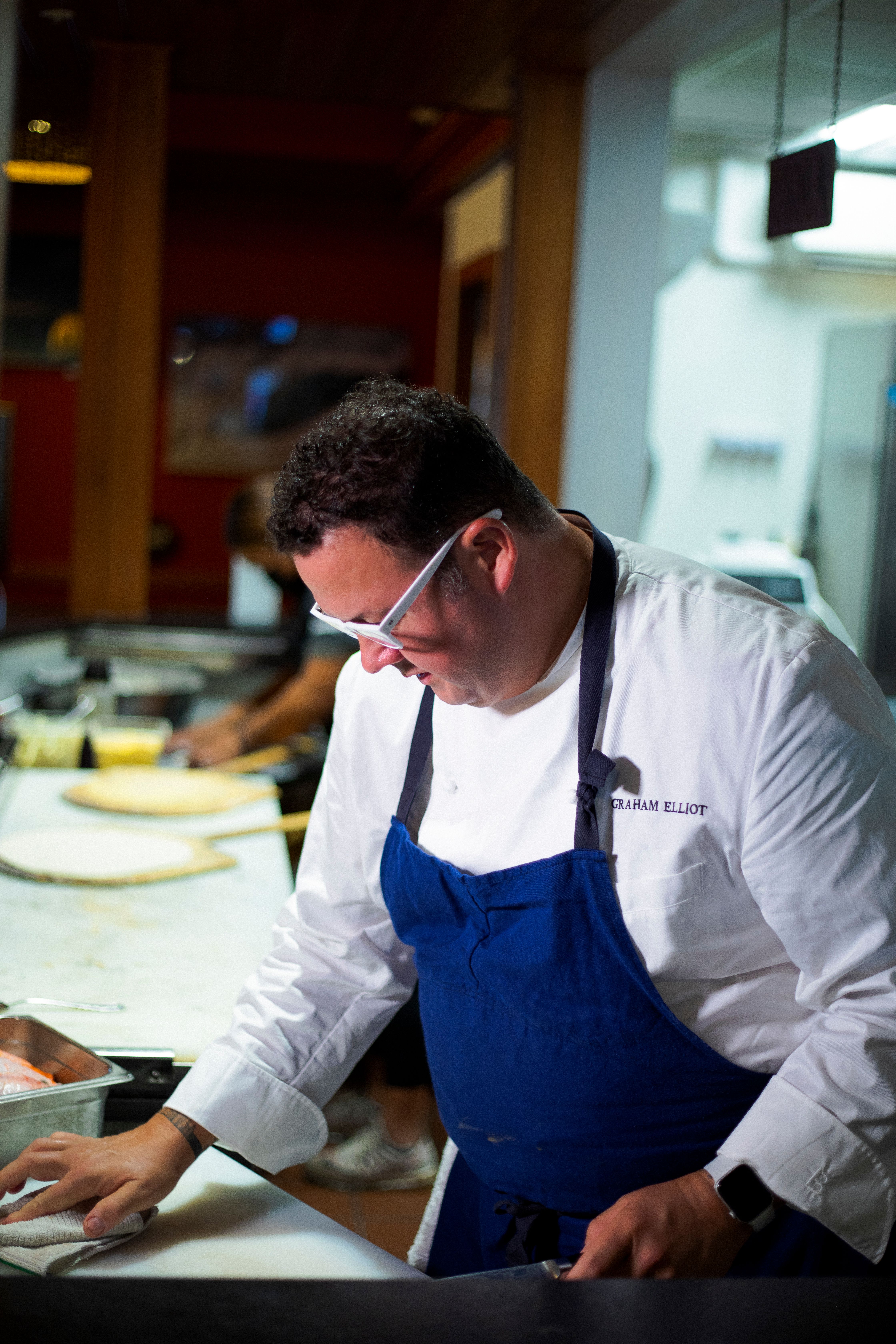 Man cooking in front of a Napalese brick oven