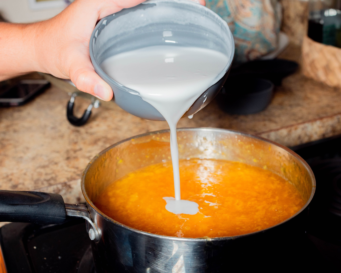 Pour coconut milk into the supoesi to give that creamy coconut flavor.