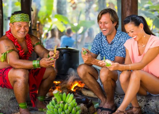 removing the skins of unripe green bananas at Samoa Village at the Polynesian Cultural Center