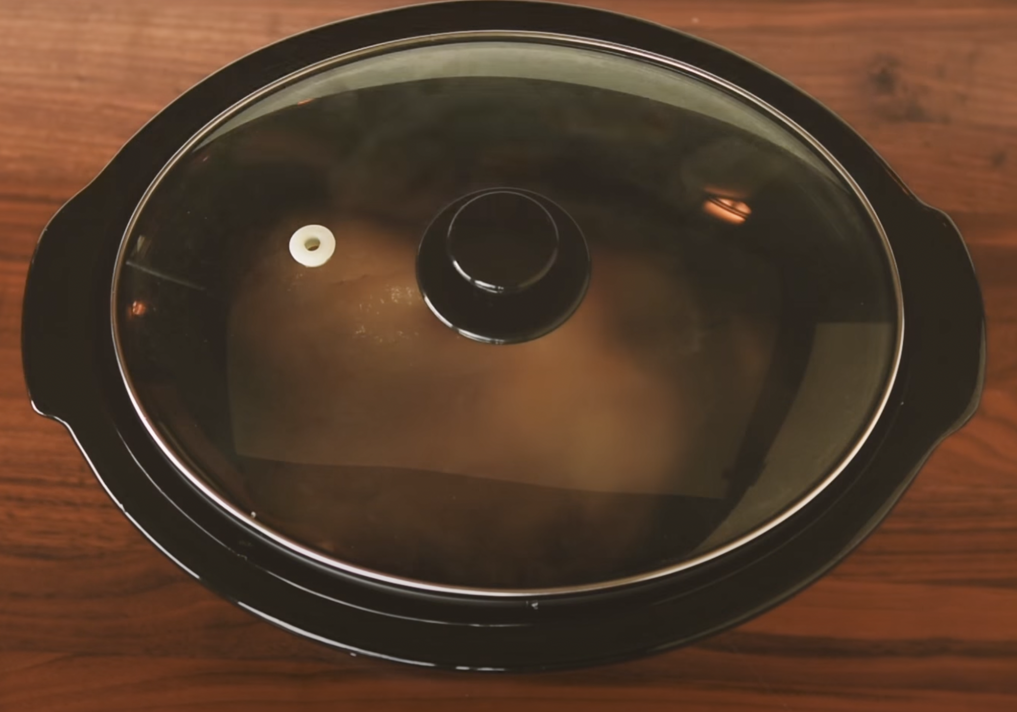 photo of kalua pork in a slow cooker. Method 2: Slow Cooker