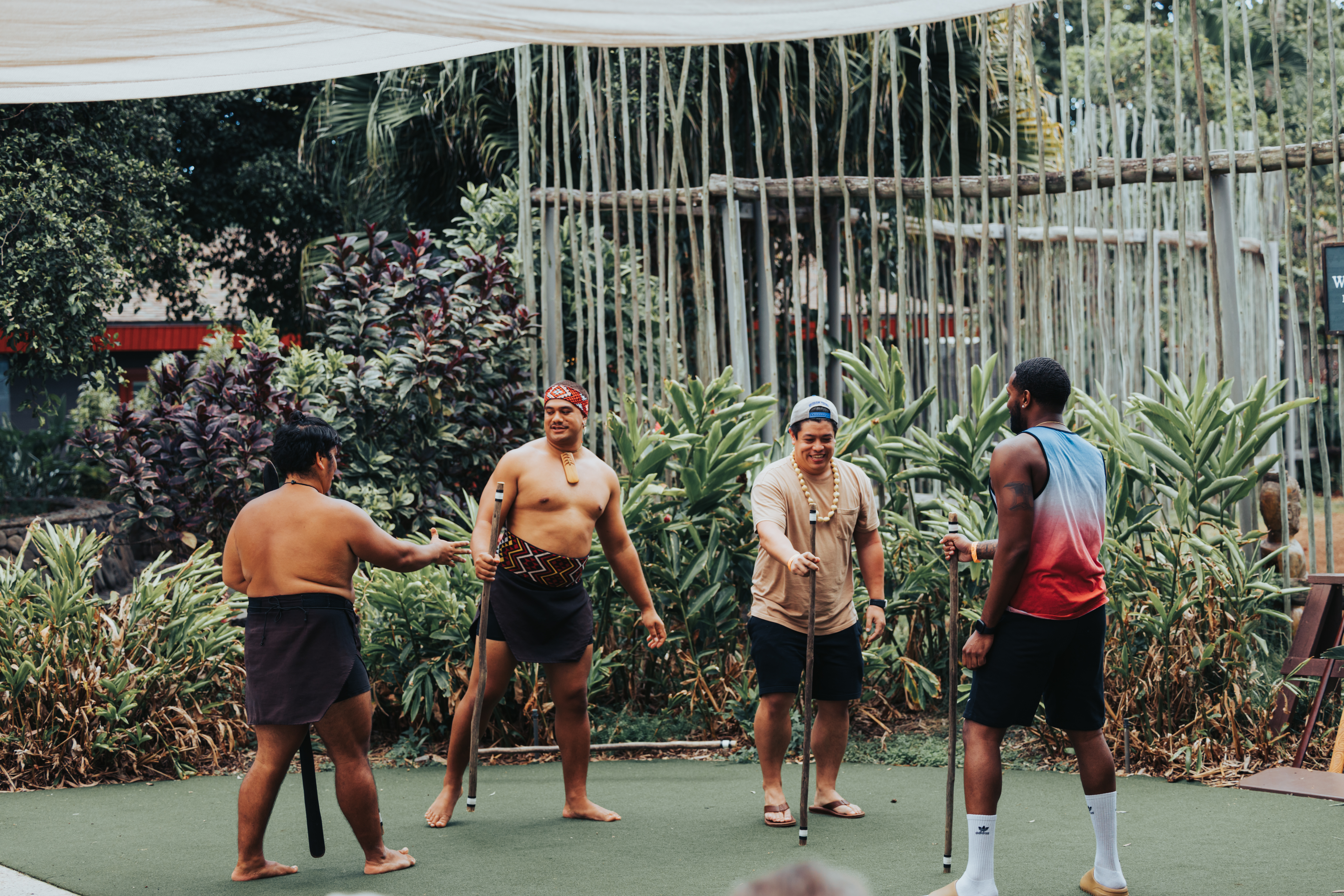 photo of Maori village performers. Different positions, but the same purpose.