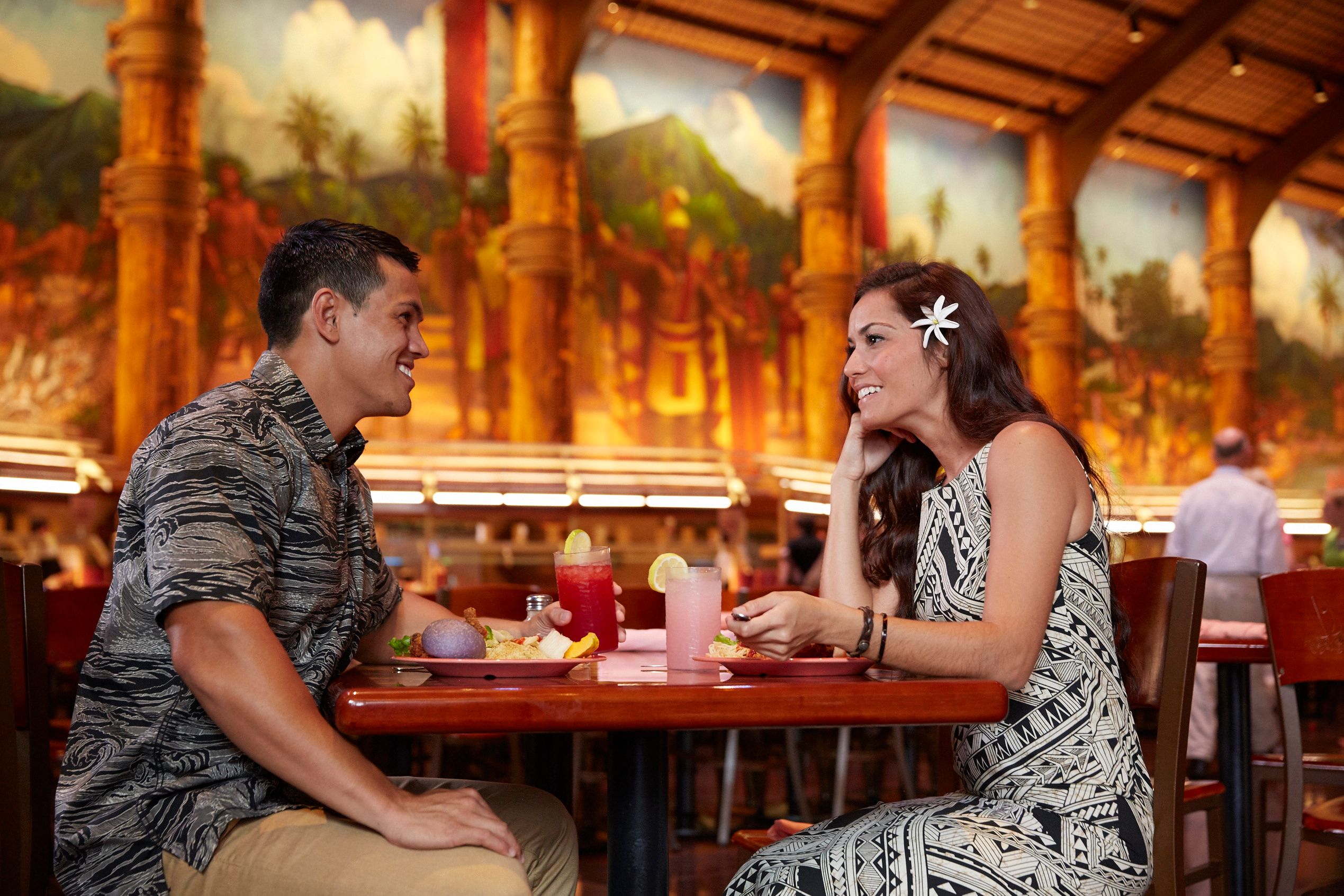 photo of a beautiful couple wearing Aloha attires dining in our Gateway Buffet at the Center. A romance dinner!