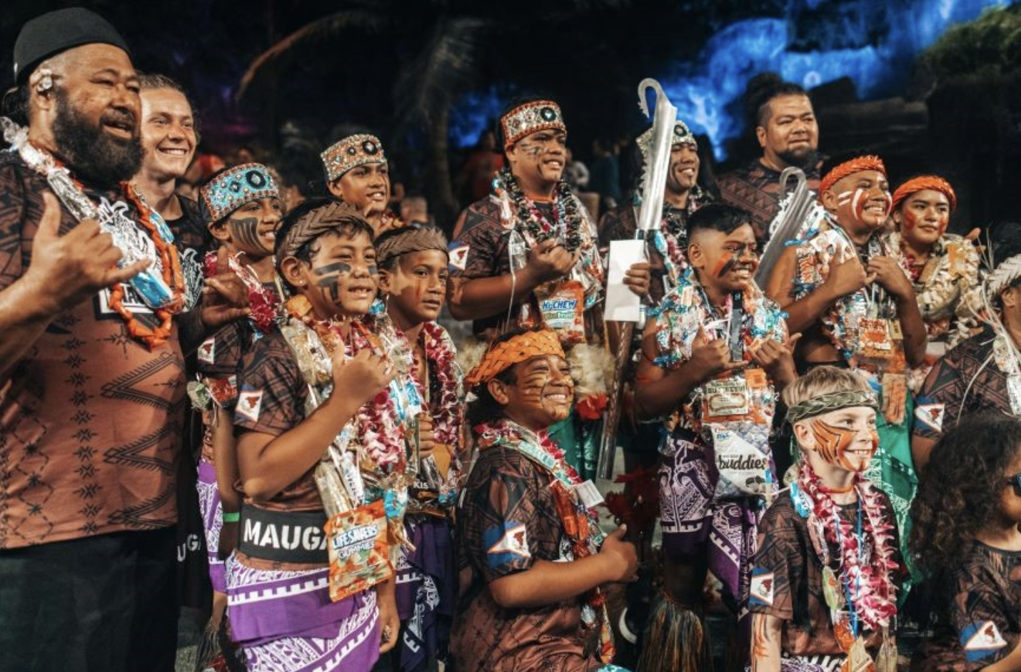the 2022 World Firenife Competition team of young competitors and their leaders pose for a picture