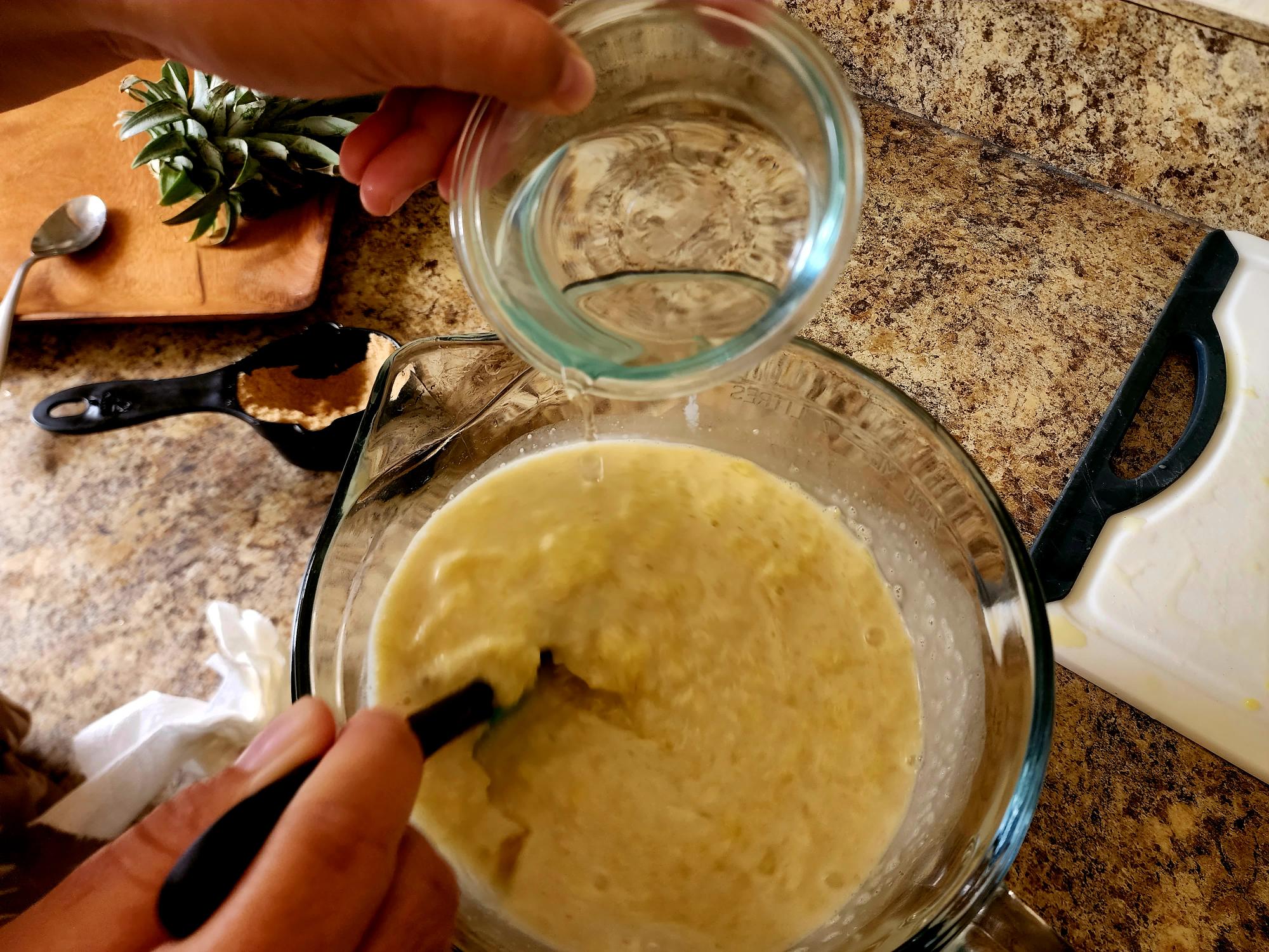 photo of a 1/2 cup of water added to the mixture. Halfway trhough to make vaifala. 
