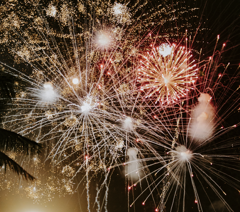 photo of fireworks in the black sky during 4th of July celebration. 