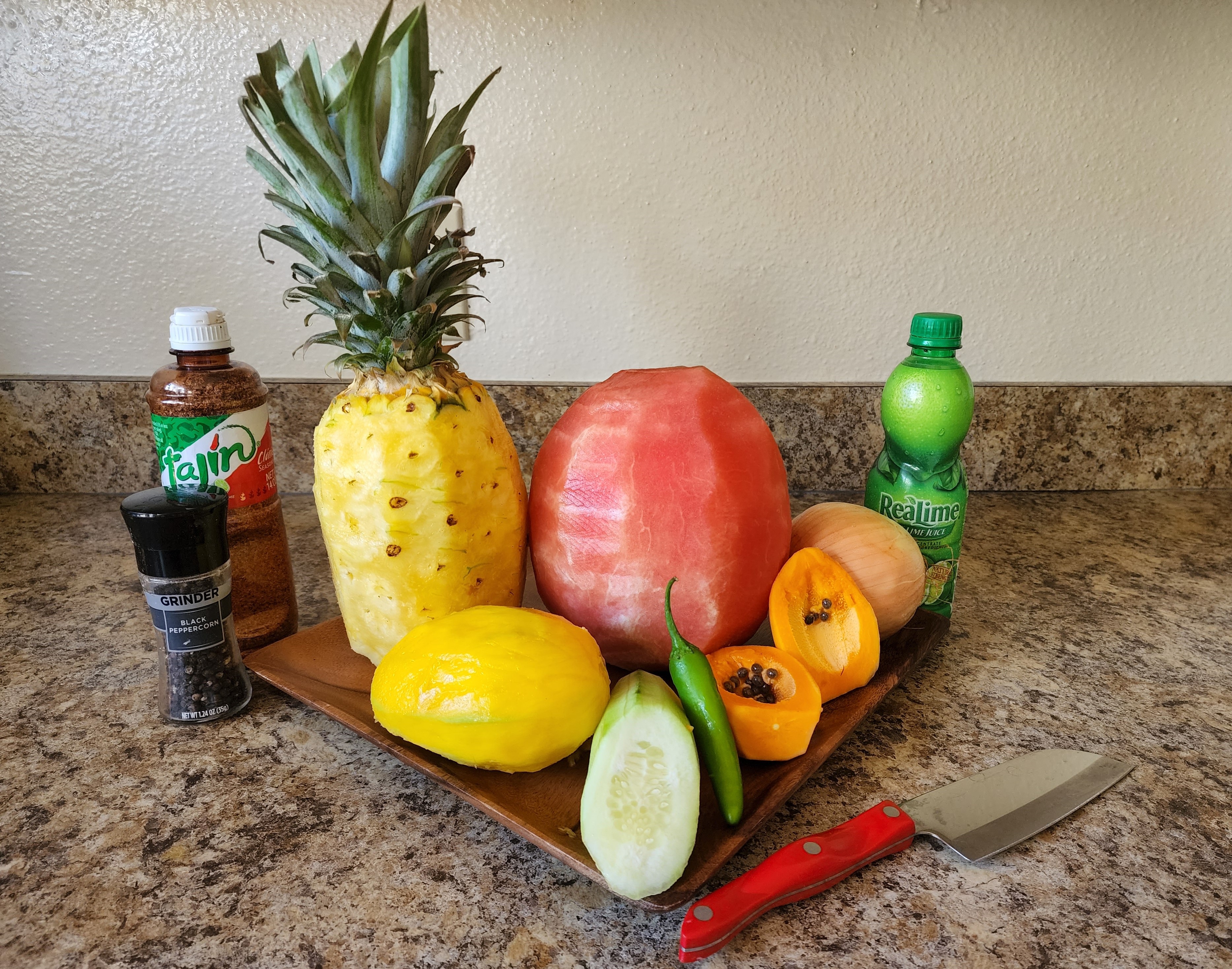 image of numerous fresh fruits peeled and ready to chop for the fresh tropical fruit salsa recipe