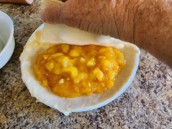 folding the crust over the filling