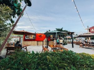 Image of Tita's Grill food truck with customers ordering!