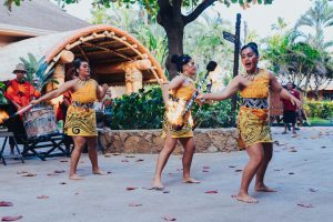 photo of the Galea'i daughters performing fireknife at the 2023 Polynesian Football Hall of Fame