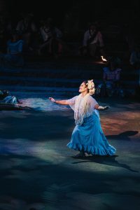 A mother dances hula for her son, a common birthday gift in Hawaiian culture.