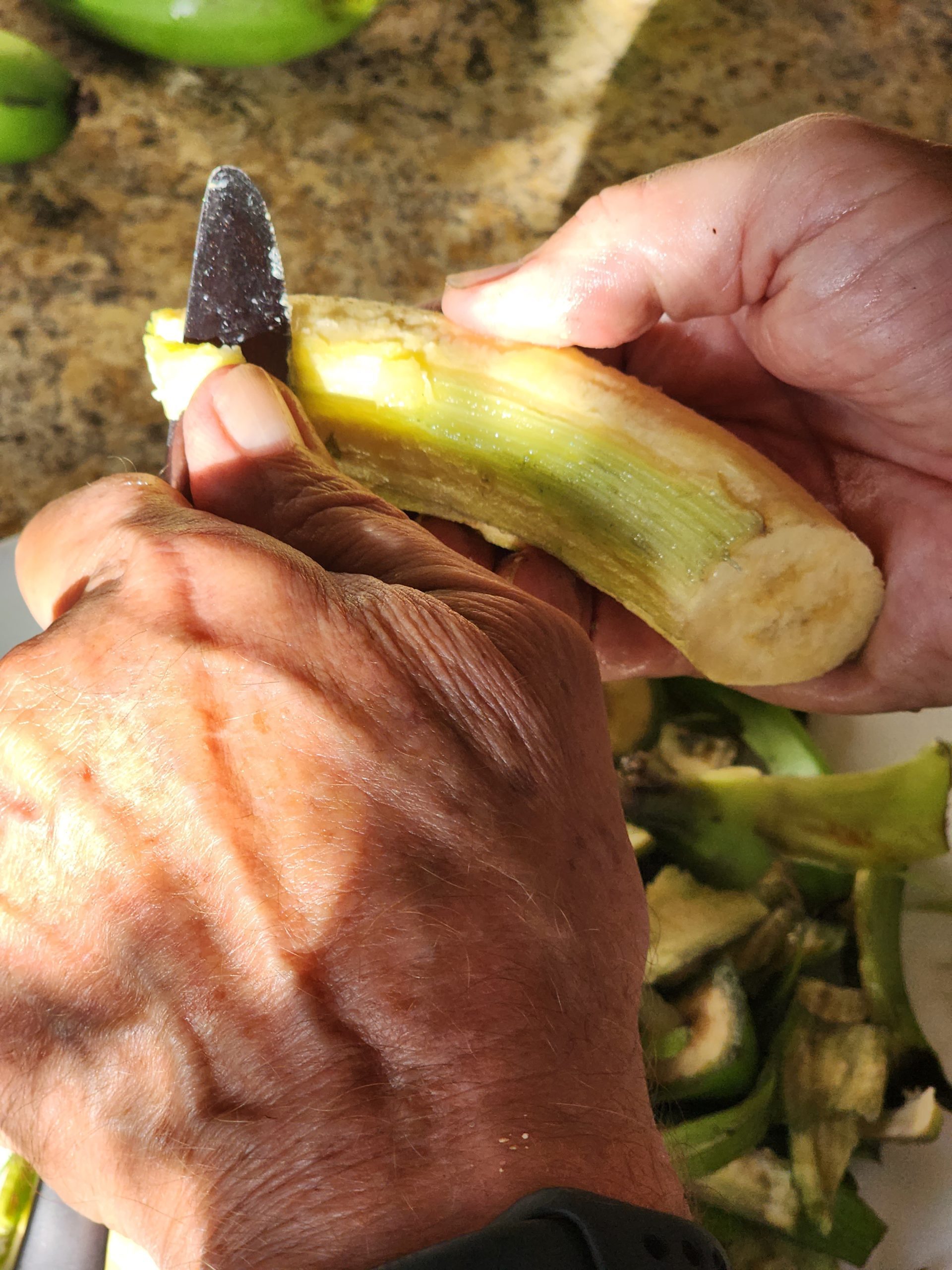 cleaning off fibers on banana